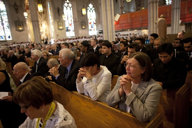 People attend the funeral mass for Cardinal Aloysius Ambrozic at St. Michael's Catholic Cathedral, in Toronto, August 31, 2011.    REUTERS/ Brett Gundlock (CANADA - Tags: SOCIETY RELIGION OBITUARY)